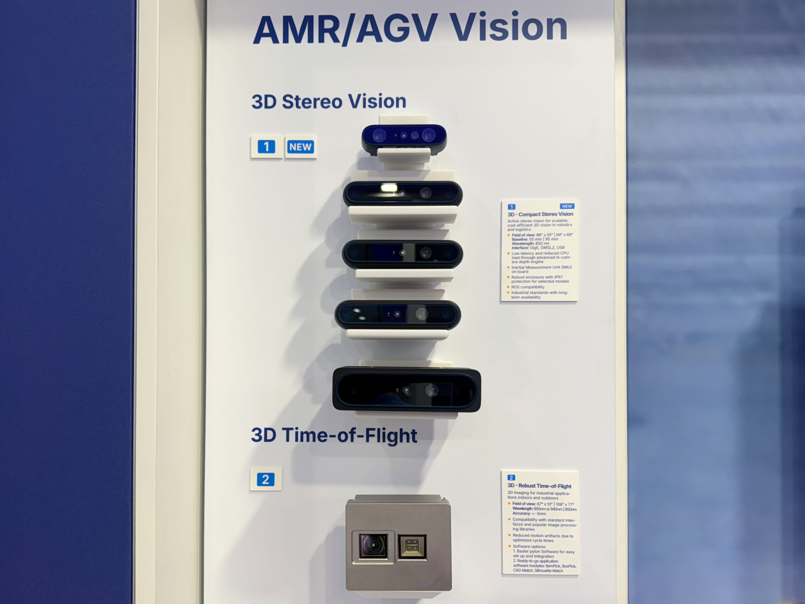 Basler AMR/AGV Vision display board at LogiMAT 2026 showing the 3D Stereo Vision Compact Stereo camera product line and 3D Time-of-Flight camera for robotics and logistics applications