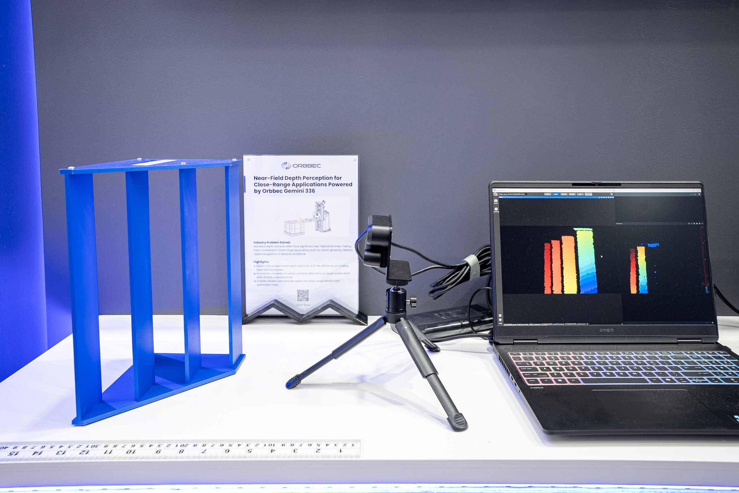 Orbbec Gemini 336 camera on tripod demonstrating near-field depth perception for close-range applications with depth visualization on laptop at LogiMAT 2026