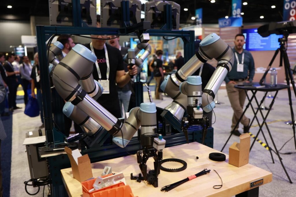 Teradyne Robotics UR AI Trainer dual-arm cobot setup with leader-follower configuration for Physical AI imitation learning data collection at Automate 2026