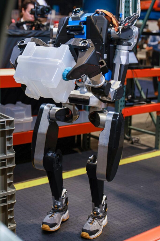 Close-up of Noble Machines Moby robot torso showing Orbbec Gemini 336L stereo 3D cameras and Livox MID-360 LiDAR sensor mounted on the robot chest for depth perception and navigation